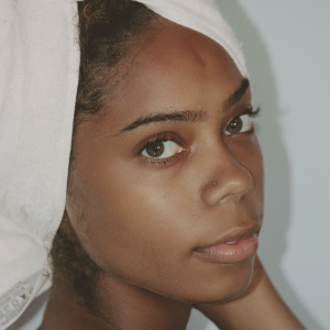 feminine -black-woman-with-white-towel-wrapped-head